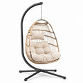 Sillón colgante de ratán sintético con cojín crema