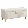 Banco de almacenamiento de tela beige con patas de madera